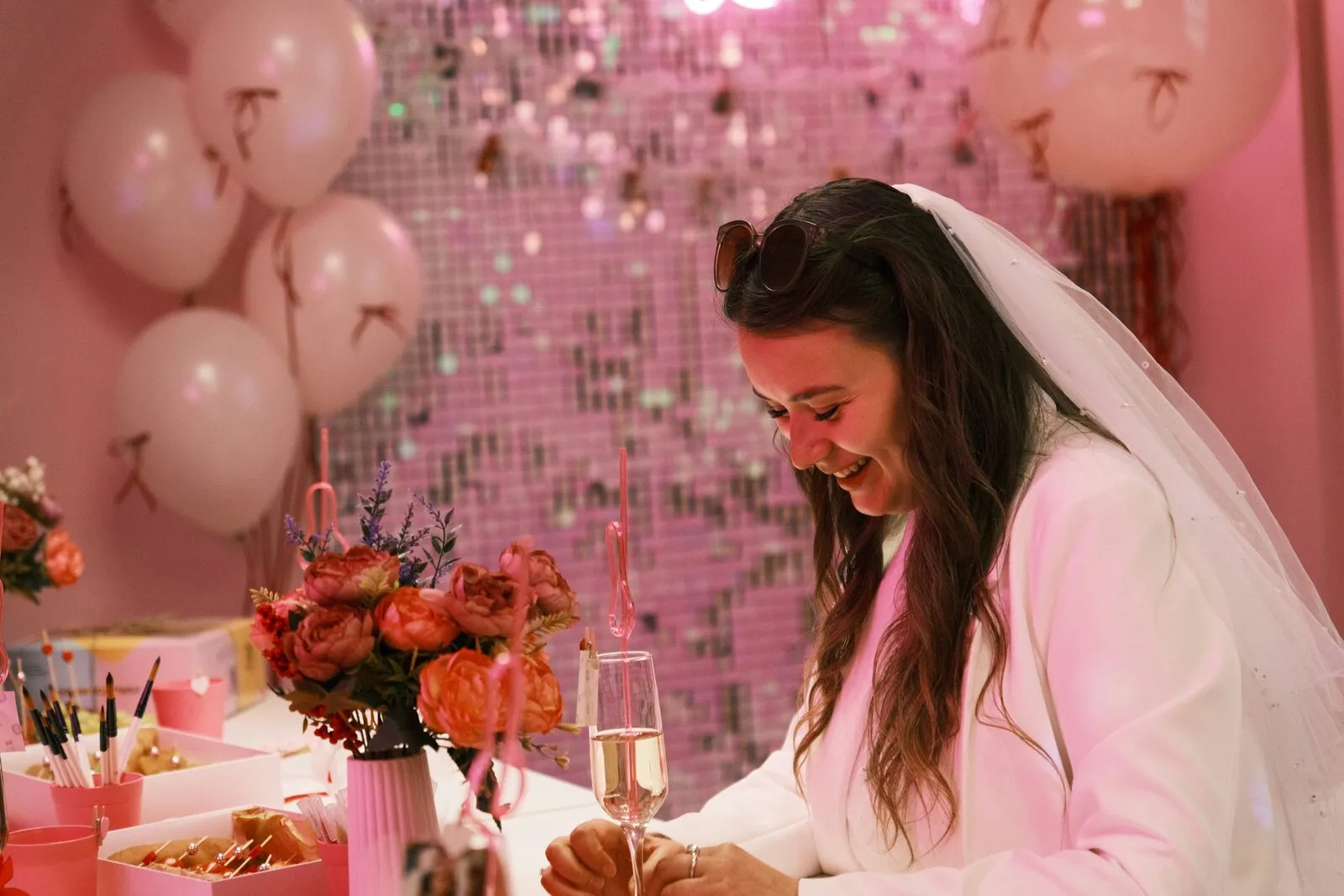 Bridal shower celebration with pink balloons and flowers by Eshas Events London